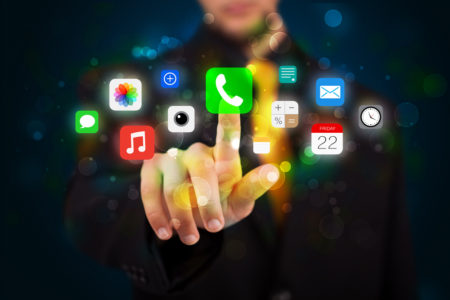 User taps colorful mobile app icons.